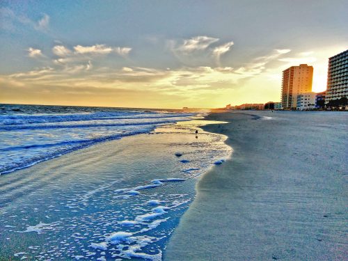 scenic-view-sea-against-sky-city-min